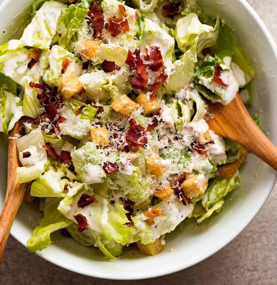 Caesar salad with crisp lettuce, bacon, Parmesan, croutons and creamy dressing